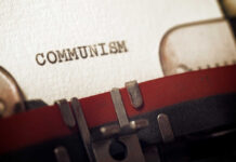 Murder Case UNLEASHED By U.S. Against Communist Leader Close-up of a typewriter with the word 'COMMUNISM' typed on paper