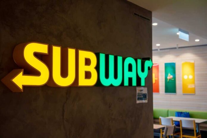 shutterstock_2226570127.jpg Illuminated Subway restaurant sign with green and yellow colors