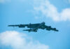 B-52 bomber flying against a blue sky