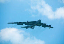 B-52 bomber flying against a blue sky
