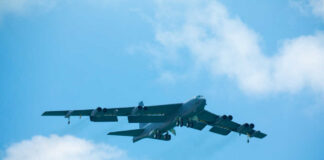 B-52 bomber flying against a blue sky