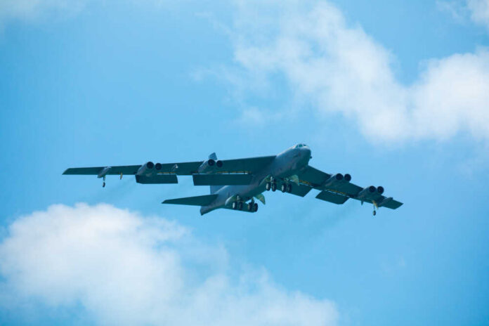 B-52 bomber flying against a blue sky