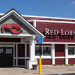 Red Lobster Flagship Killed Because of THIS! Exterior view of a Red Lobster restaurant with a lobster sign