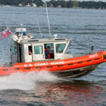 Coast Guard Stops Search, But Grabs the Boat U.S. Coast Guard boat speeding through water