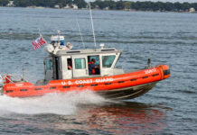 Coast Guard Stops Search, But Grabs the Boat U.S. Coast Guard boat speeding through water