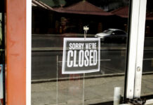 59 Store Closures, But Not Dead? Closed sign hanging on a glass door