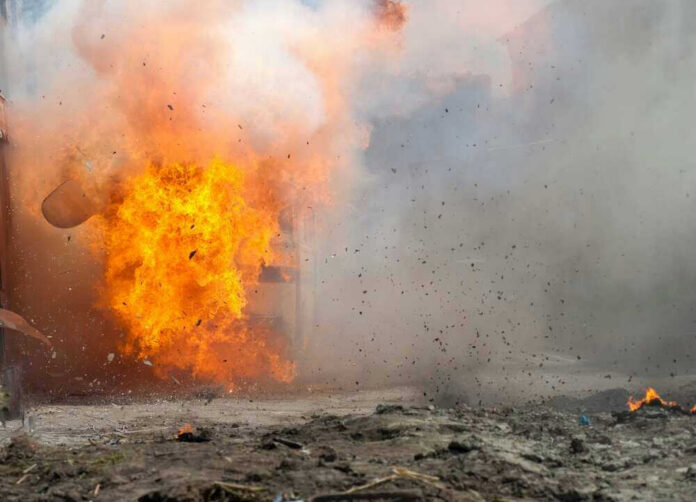 shutterstock_2144326471 A large explosion with flames and smoke.