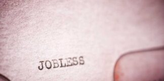 Close-up of a typewriter with the word 'JOBLESS' typed on paper
