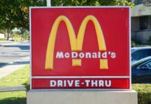 McDonald’s Bets Big On THIS New Plan McDonald's drive-thru sign with iconic golden arches