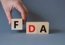 VIDEO: FDA Races Nightmare – Pets At Risk A hand holding a wooden block with the letter F, next to blocks spelling FDA