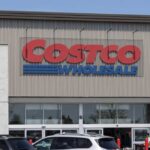 Exterior view of a Costco Wholesale store with a clear blue sky
