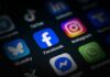 Facebook User Payout Checks Return — But With a Catch Close-up of various social media application icons on a smartphone screen