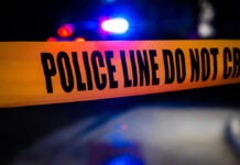 VIDEO: Street Turns Into Cop Killing Zone Police tape with flashing lights in the background.