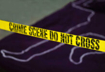 4th of July Horror: Kids Shot At Barbecue Yellow crime scene tape marking off an area with a chalk outline
