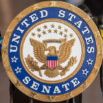 Senators’ AI Power Grab Explodes – What Now? United States Senate seal with microphones in front.