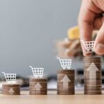 Food Inflation Bites — Brands Panic Shopping cart filled with various groceries in a supermarket aisle