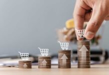 Food Inflation Bites — Brands Panic Shopping cart filled with various groceries in a supermarket aisle