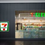 Exterior view of a 7-Eleven convenience store with All Cafe signage