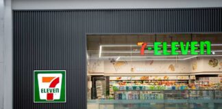Exterior view of a 7-Eleven convenience store with All Cafe signage