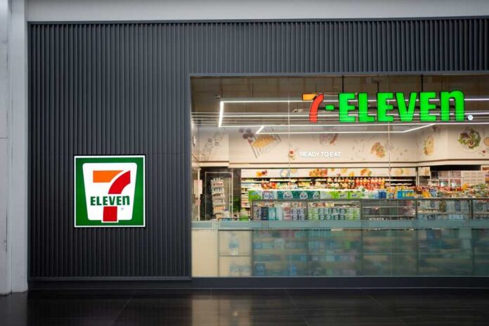 Exterior view of a 7-Eleven convenience store with All Cafe signage