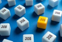 Jobs ‘Gain’ Hides Massive Worker Problem A yellow cube with the word 'JOB' surrounded by white cubes with the same word on a blue background