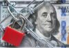 Price-Fixing Panic — States Get The Call A red padlock and chain over a hundred dollar bill featuring Benjamin Franklin