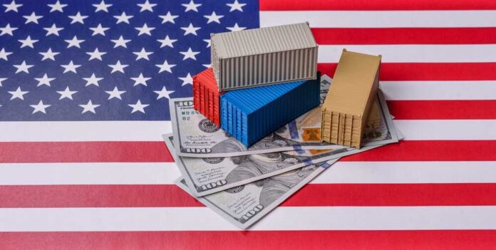Mini shipping containers on US dollars over an American flag