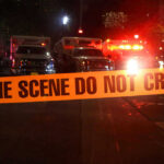 Museum Meltdown: Thieves Walked Right In Crime scene tape with emergency vehicles in background.