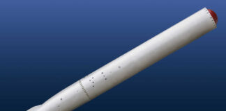A missile displayed against a blue background