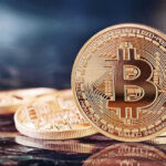 Bitcoin Vaults Gutted in 41 Minutes Bitcoin coins on a reflective surface.