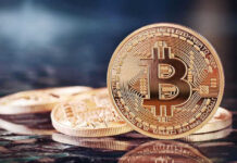 Bitcoin Vaults Gutted in 41 Minutes Bitcoin coins on a reflective surface.