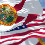 Florida state flags waving in the wind.