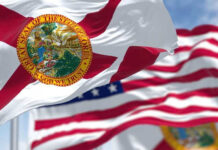 Florida state flags waving in the wind.