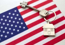 House key with keychain on American flag