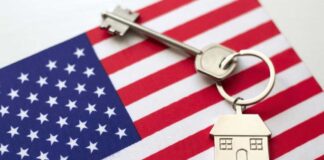 House key with keychain on American flag
