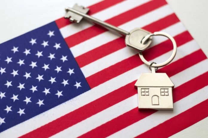 House key with keychain on American flag