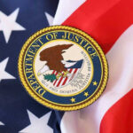 DOJ Holds The Cards On Fauci Fight Department of Justice seal on American flag.