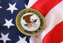 DOJ Holds The Cards On Fauci Fight Department of Justice seal on American flag.