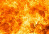 Inferno Engulfs Spokane Suburbs Bright orange and yellow flames burning intensely.