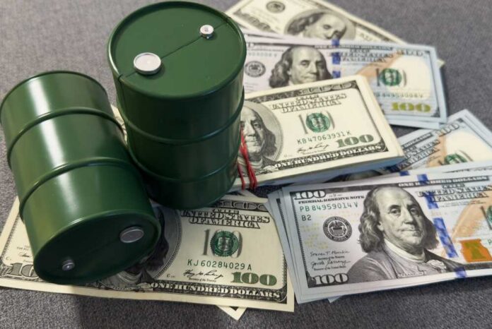 Spilled,Oil,From,A,Barrel,To,A,Dollar,Bill,Of Two green oil barrels placed on a pile of hundred dollar bills
