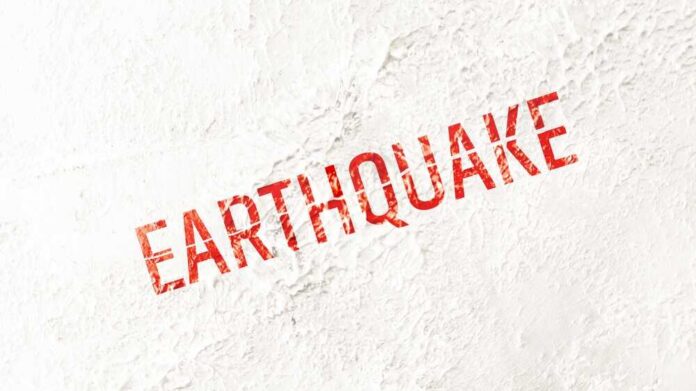 Information,Earthquake,Sign,On,White,Background Concert crowd with hands raised, bright stage lights.