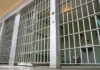 Tennessee’s Criminal Justice First In 200 Years Empty prison cell with metal bars and toilet.