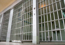 Tennessee’s Criminal Justice First In 200 Years Empty prison cell with metal bars and toilet.