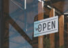 Hanging open sign on a storefront window