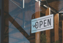 Hanging open sign on a storefront window