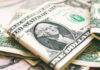 Five-Million-Dollar Families Are… Common? U.S. dollar bills with George Washington visible.