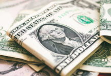 Five-Million-Dollar Families Are… Common? U.S. dollar bills with George Washington visible.