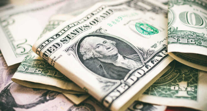 U.S. dollar bills with George Washington visible.