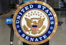 Frail Return Stuns Senate Seal of the United States Senate displayed prominently