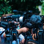 Reflecting Pool Meltdown Exposes Contractor Chaos TV news cameras crowding together at an outdoor event